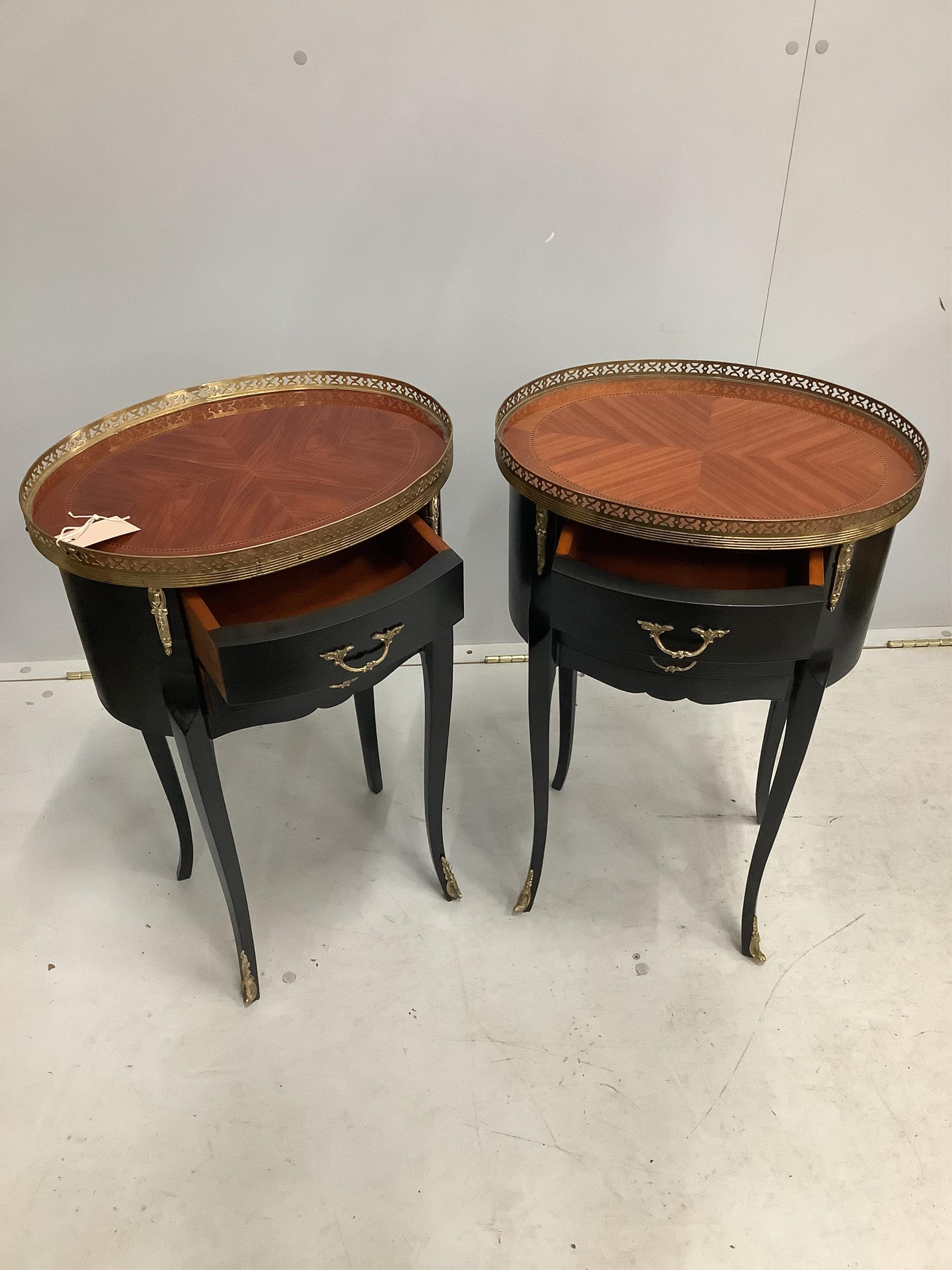 A pair of Continental ebonised occasional tables with brass galleries, width 42cm, depth 31cm, height 67cm. Condition - good